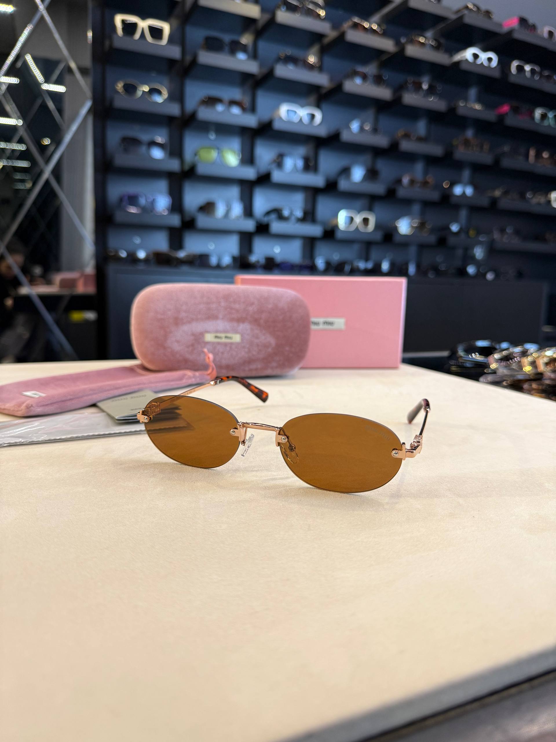Miu Miu Rimless Oval